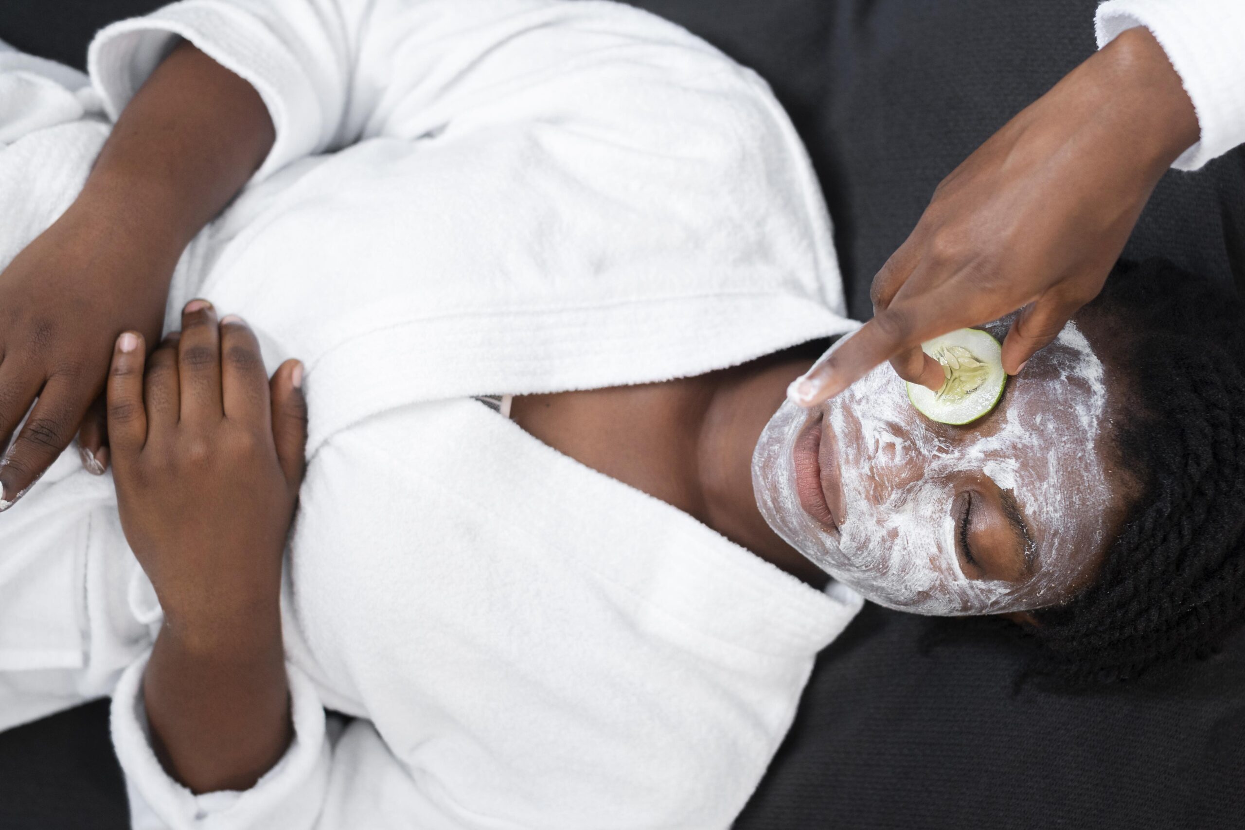 beautiful woman doing facial treatment home